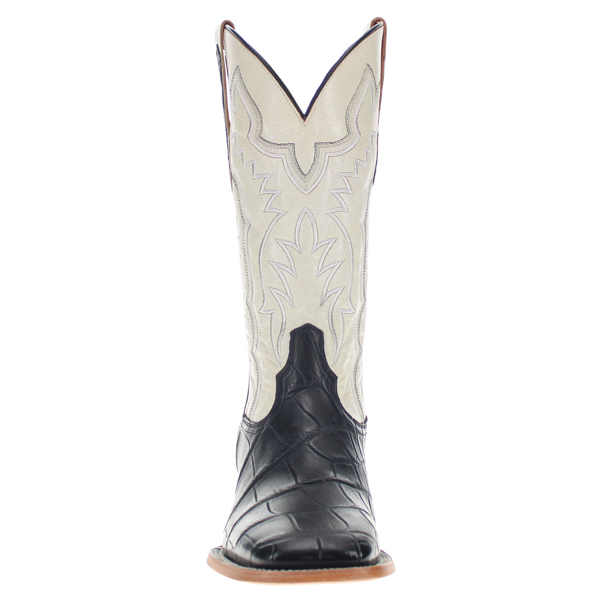 Cream-and-black cowboy boots with embroidered floral stitch and tan leather sole