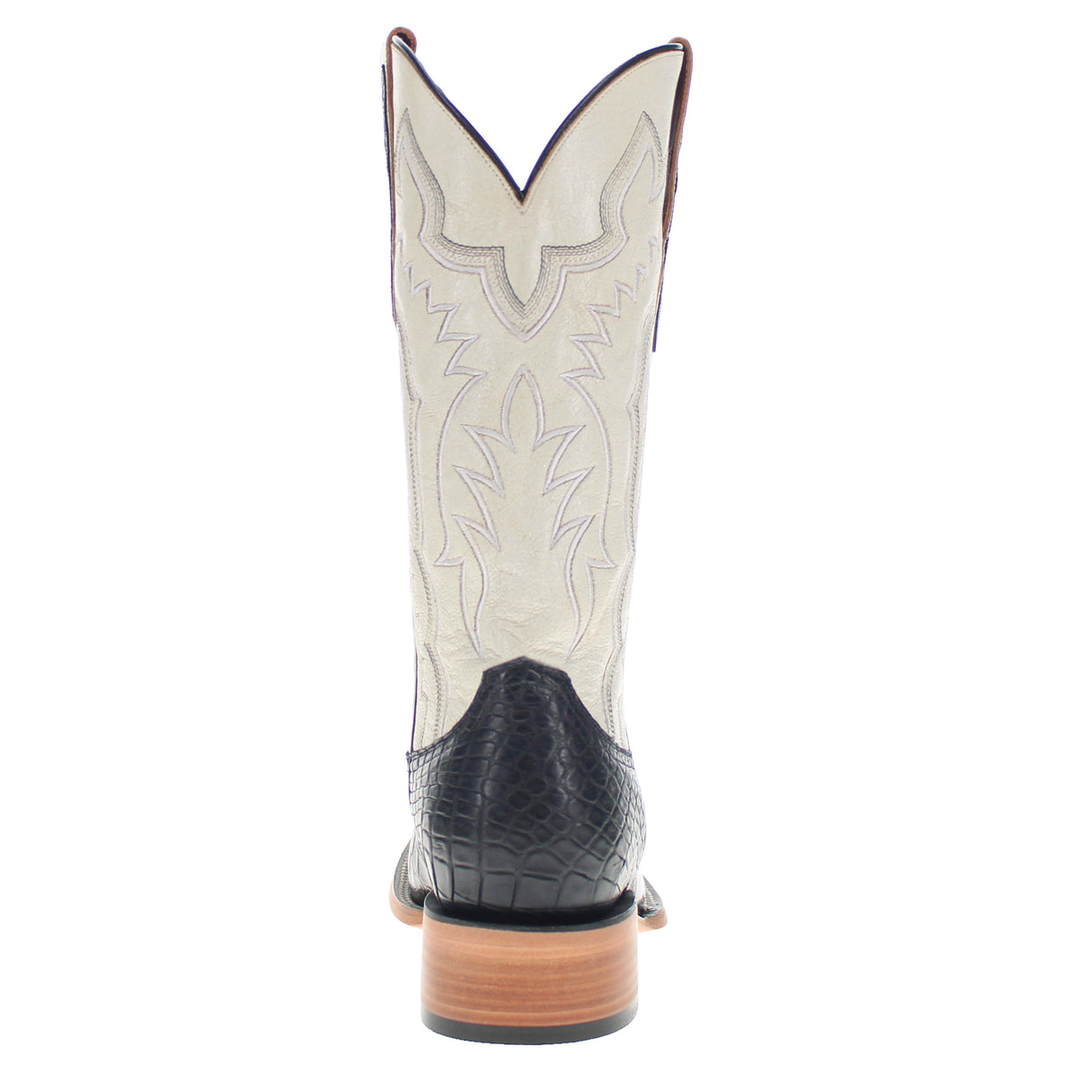 Cream-and-black cowboy boots with embroidered details, black heel panel, tan sole