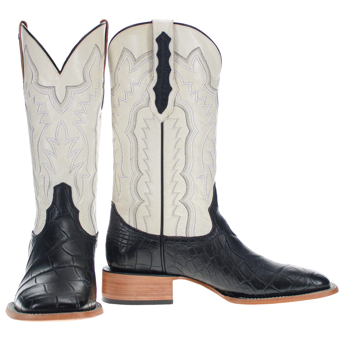 Pair of cream and black cowboy boots with embroidered shaft panels and tan soles