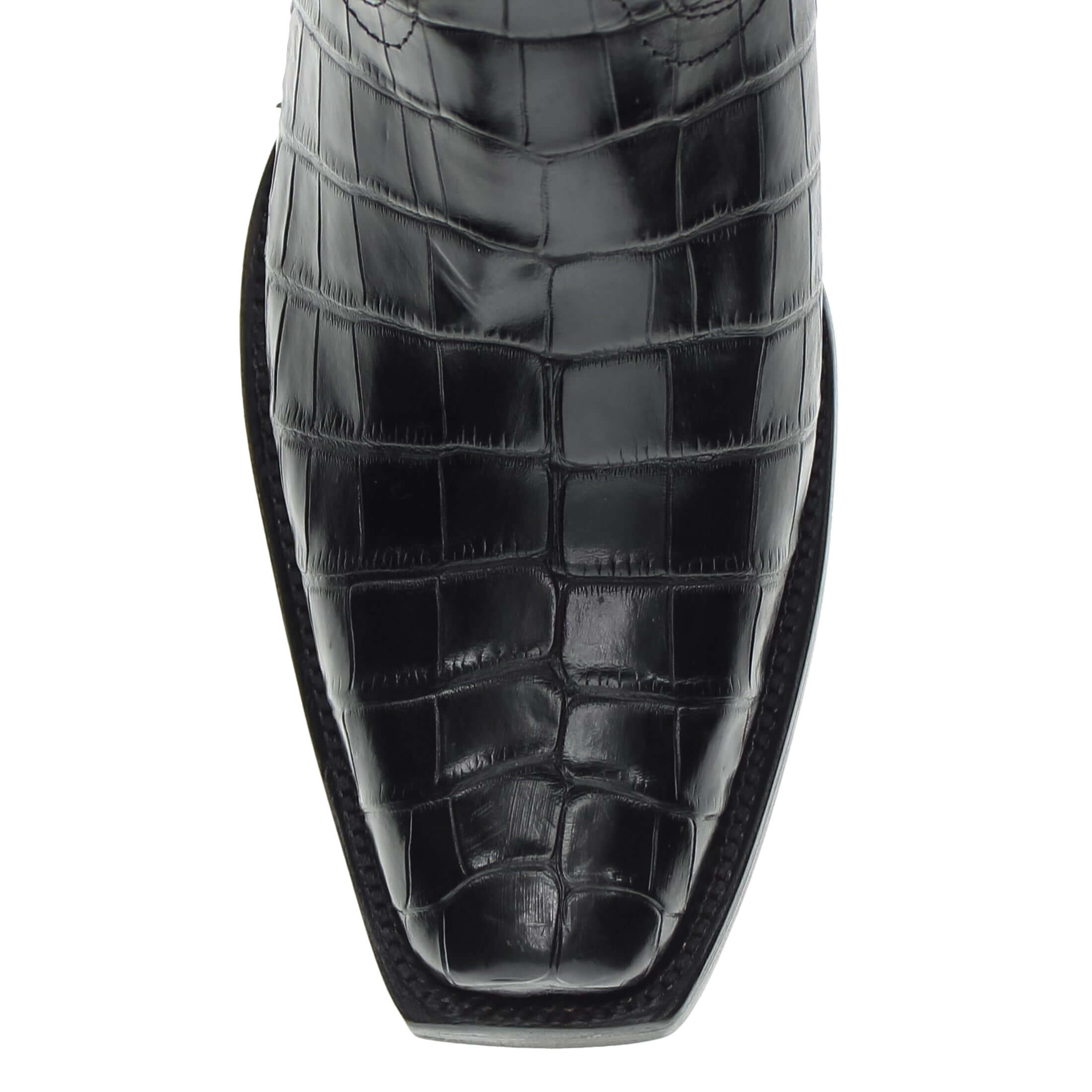 Pair of black alligator cowboy boots with caiman crocodile texture