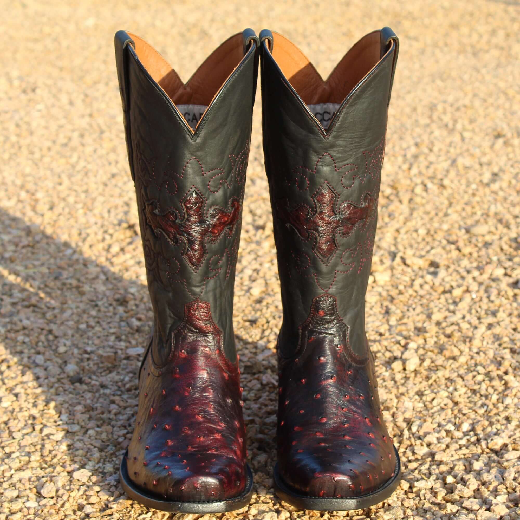 Mens black cherry leather western boots with narrow square toe and decorative stitching, featuring full-quill ostrich leather on the foot for added texture.