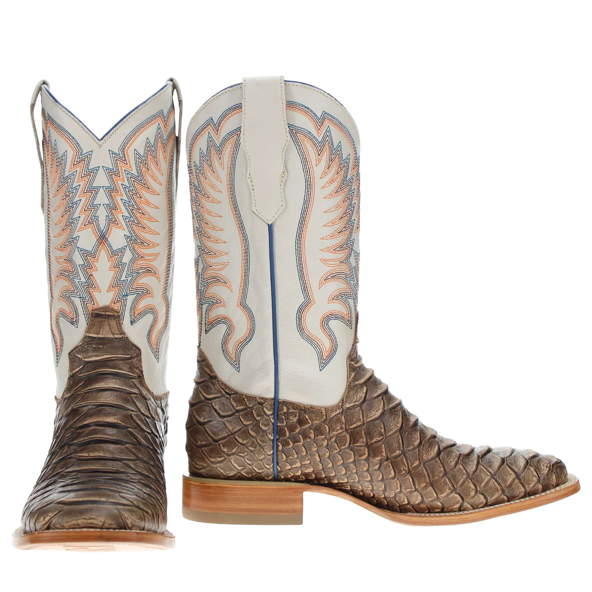 Pair of cowboy boots: white shafts with orange-blue embroidery and textured brown leather toes.