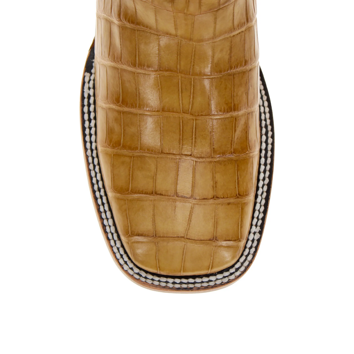 Tan crocodile-texture western boot shaft panel with braided edge and dark sole