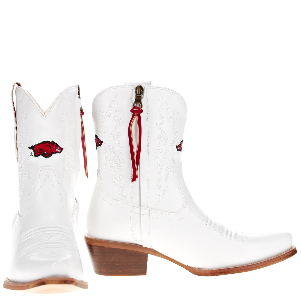 White cowboy boots with red tassel zipper pull and red logo on the side