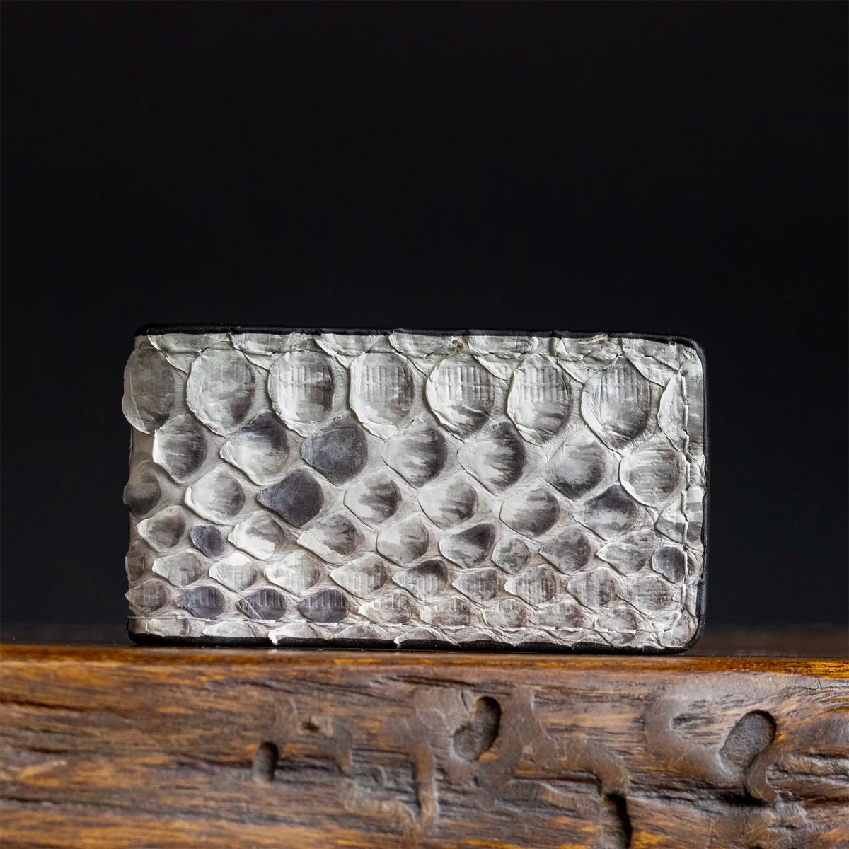 Rectangular money clip with embossed silver python-style scale pattern