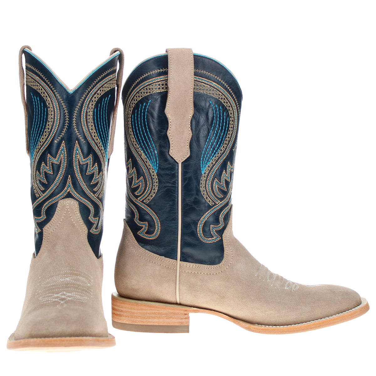 Pair of taupe suede western cowboy boots with dark blue embroidered shafts and wood heels