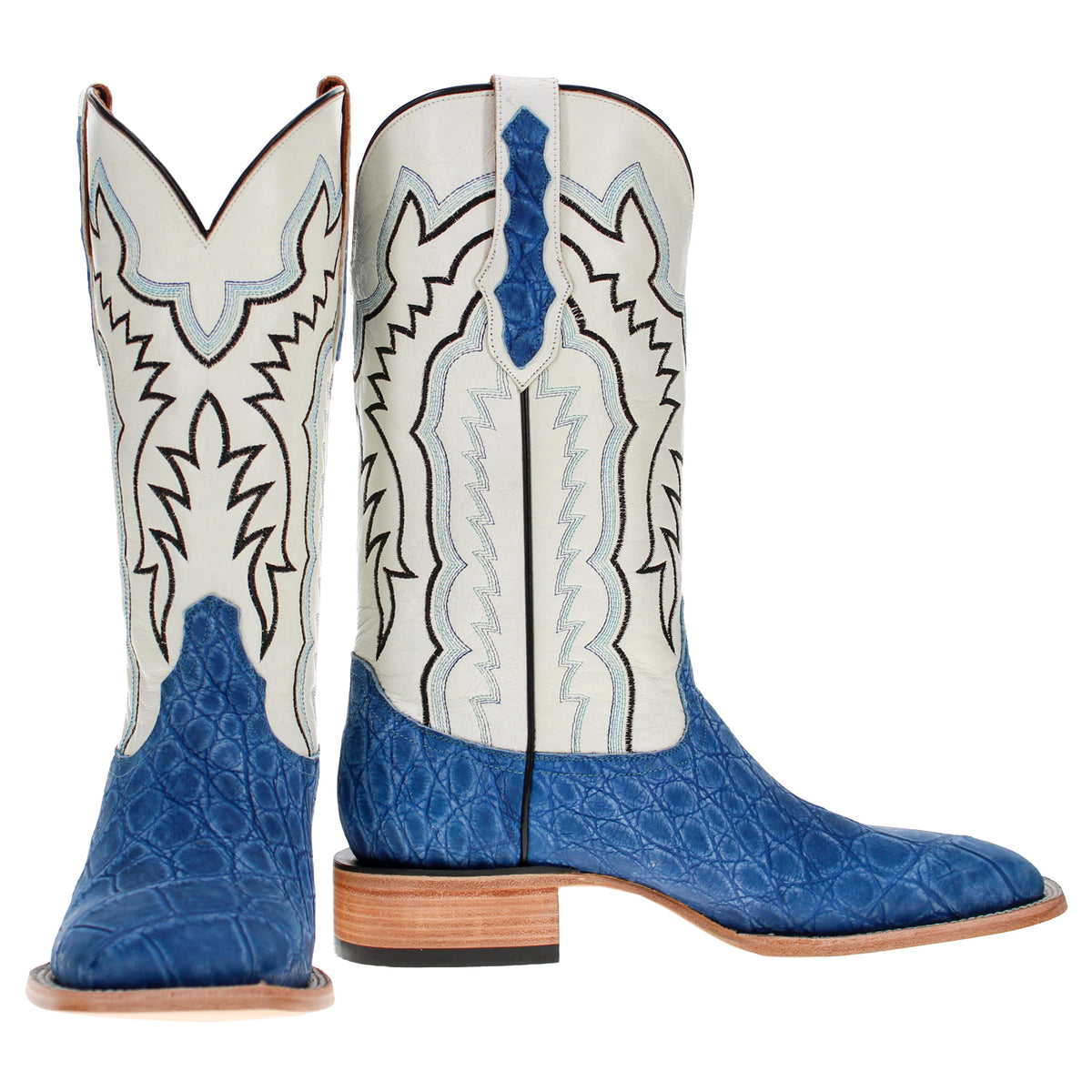 Pair of blue cowboy boots with white embroidered shafts, tall height, stacked wood heel.