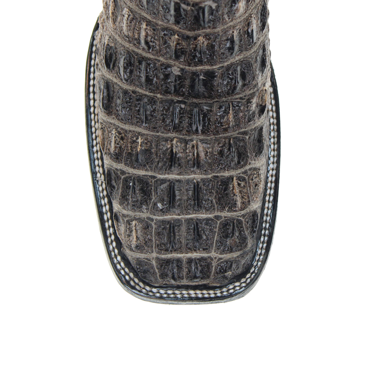 Close-up of dark crocodile-embossed toe and vamp with stitched edge and contrast trim.