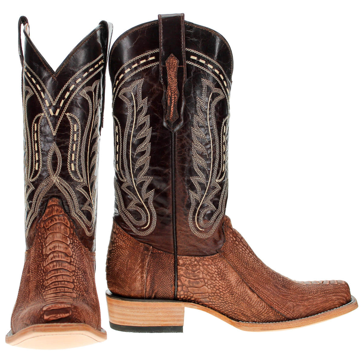Pair of western cowboy boots with ornate embroidery, textured leather shafts, and low stacked heels.