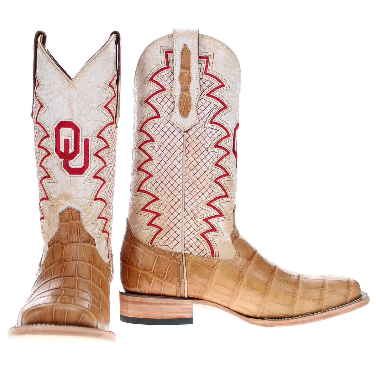 Pair of tan cowboy boots with white shafts, red emblem inlay, and brown crocodile-texture sides.