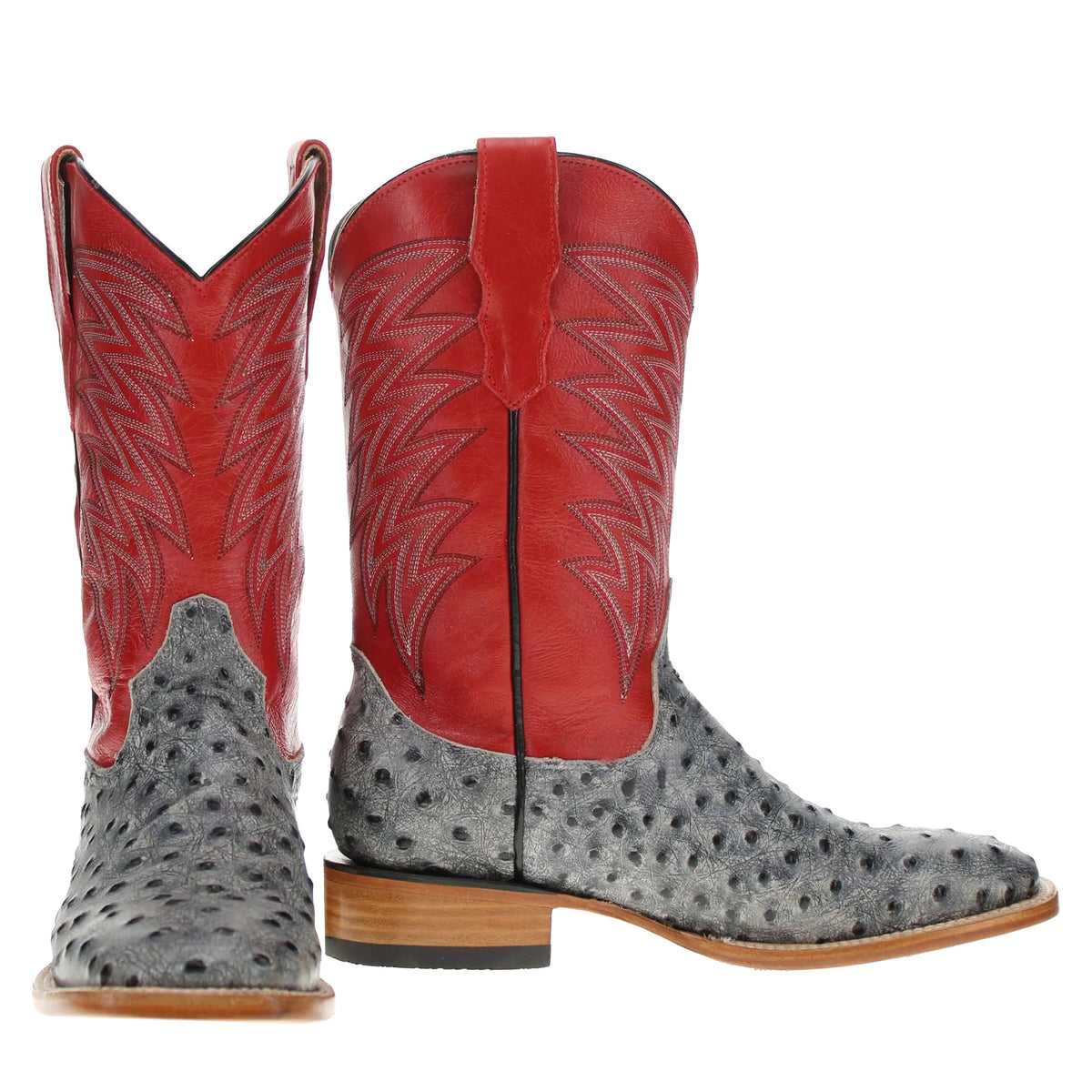 Pair of red and gray cowboy boots with stitched shafts and tan-brown soles