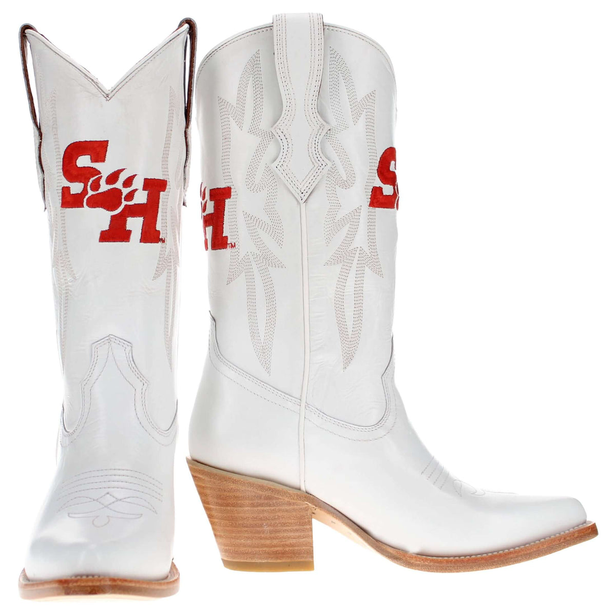 Pair of white cowboy boots with red logos and tan wooden-style heels