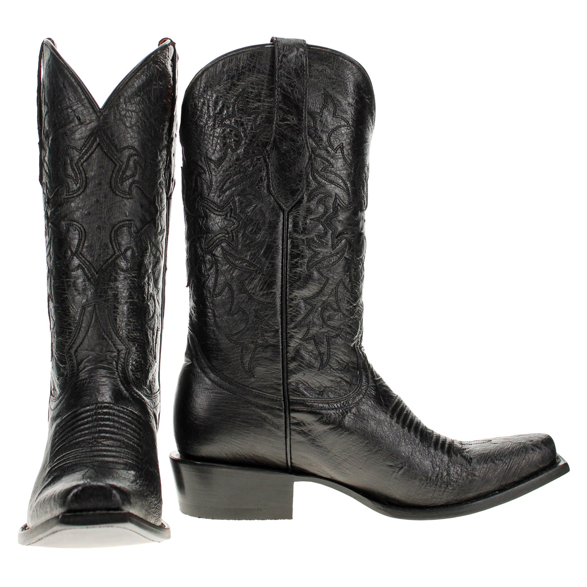 Pair of black western cowboy boots with embossed floral motifs and block heels
