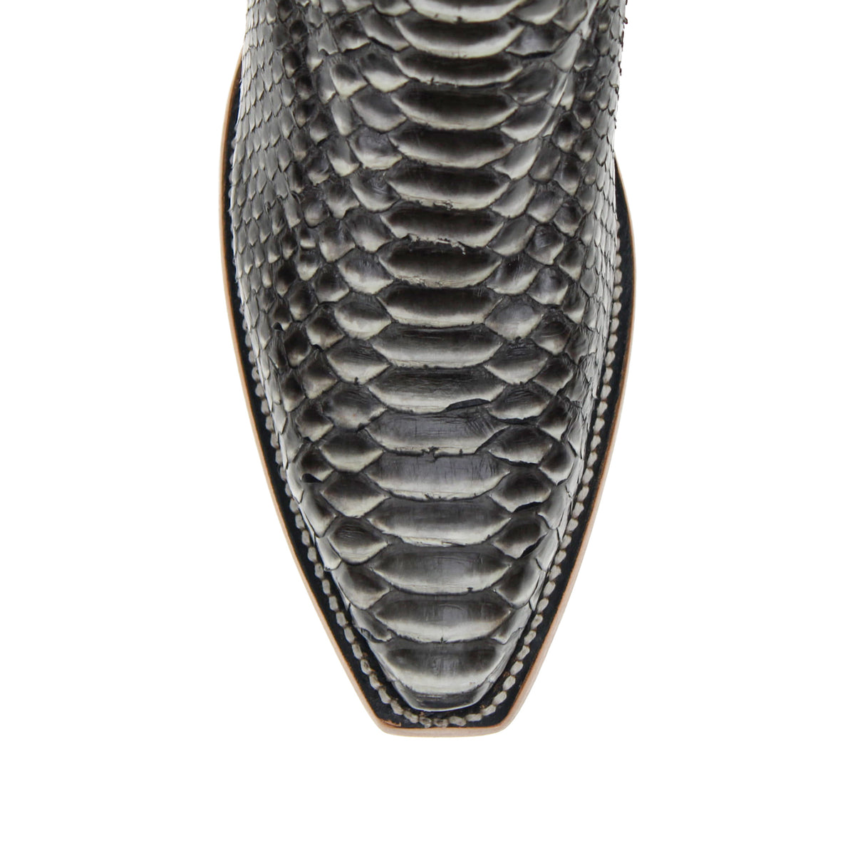 Snake-print cowboy boot upper close-up with gray scale texture and stitched trim