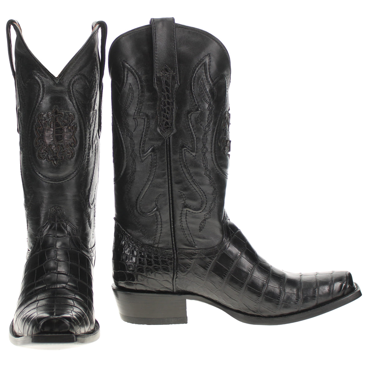 Pair of black western cowboy boots with pointed toe, pull tabs, and embossed paneling.