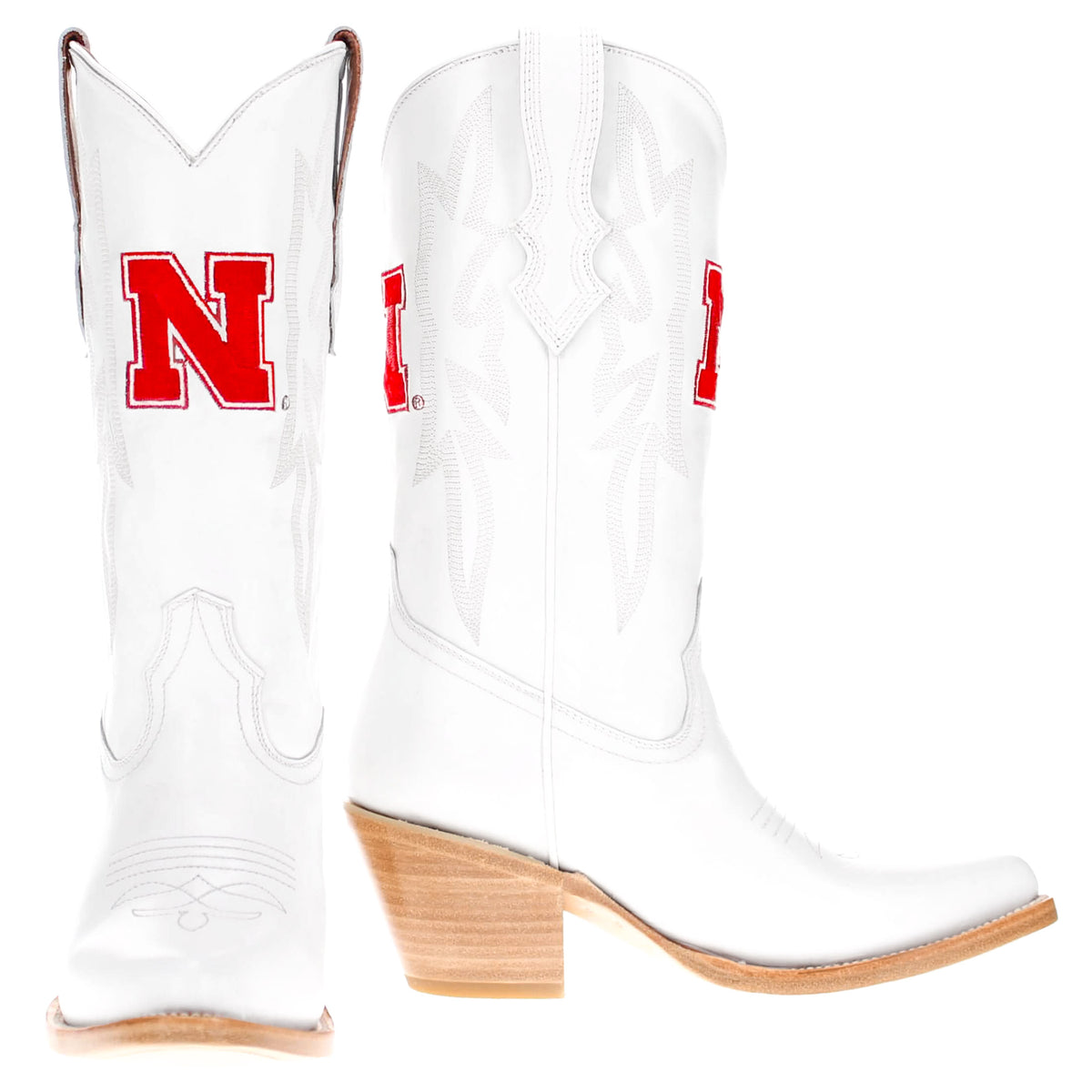 Pair of white cowboy boots with red N logos and tan stacked block heels