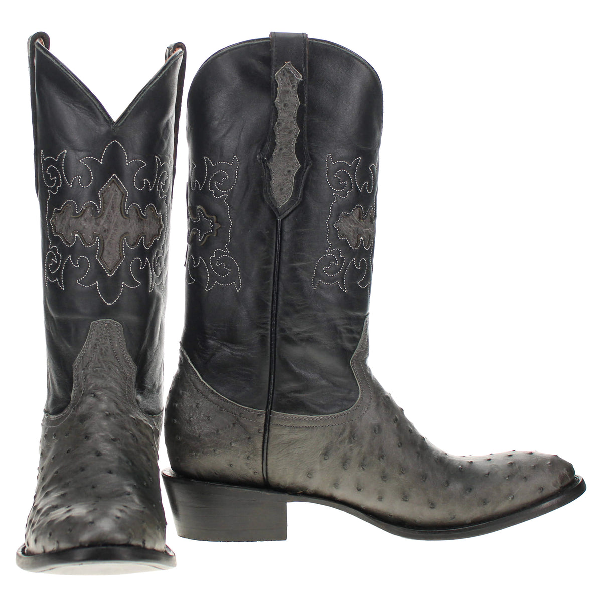 Pair of tall cowboy boots with pointed toes, dark shafts, and decorative embroidery