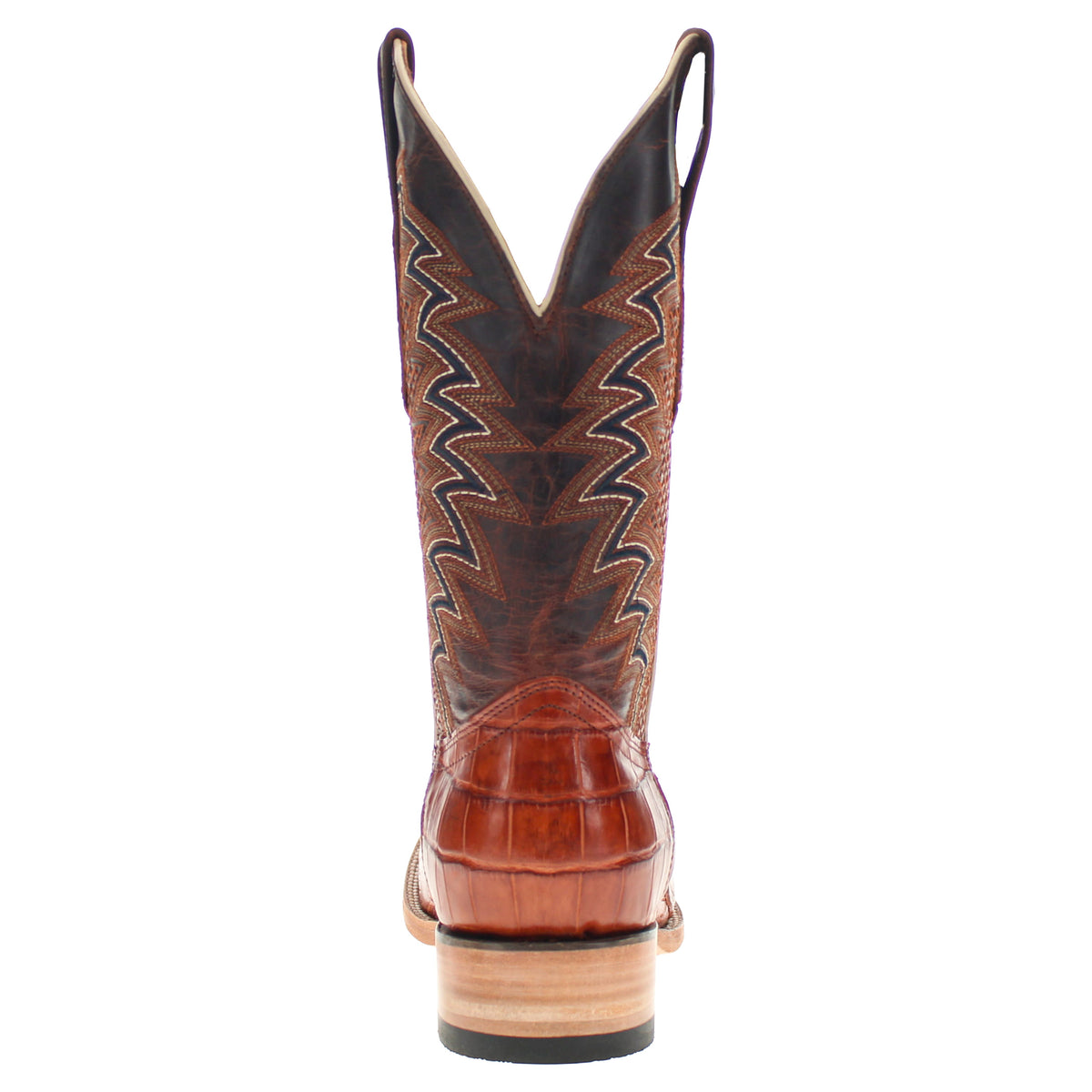 Brown cowboy boot with pointed toe, stitched western pattern on shaft and dark lining