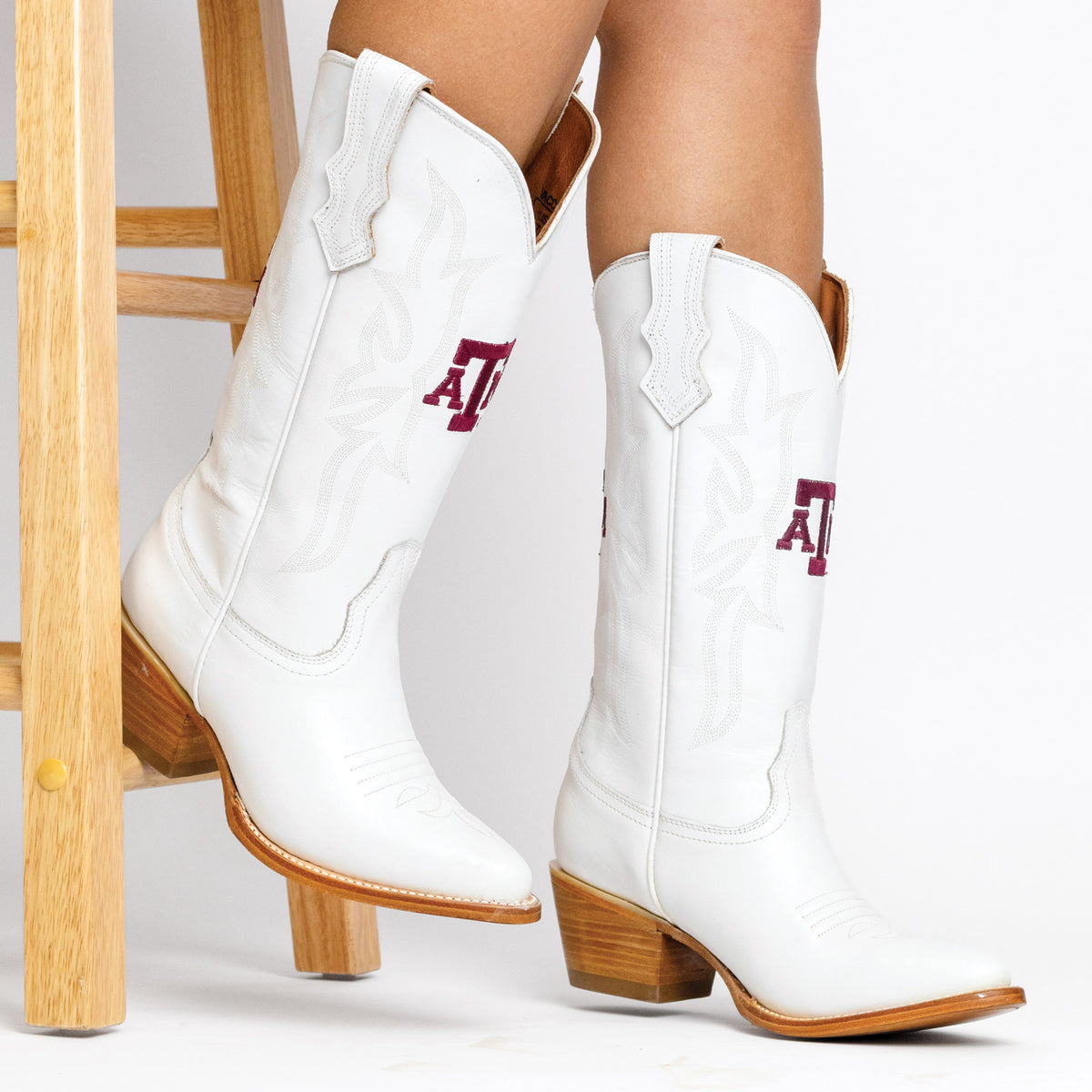 Leighton white cowboy boots with logo on sides and tan block heels