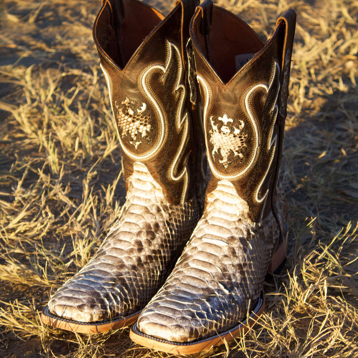 Mens black leather western boots with round toe and decorative stitching, featuring full-quill ostrich leather on the foot for added texture.