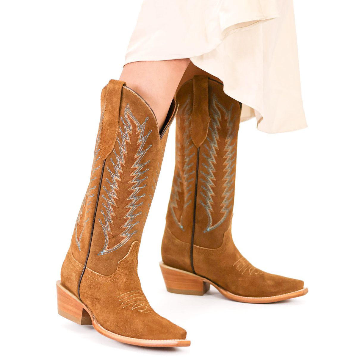 Western boots in tan suede with blue embroidered detail and wooden block heel