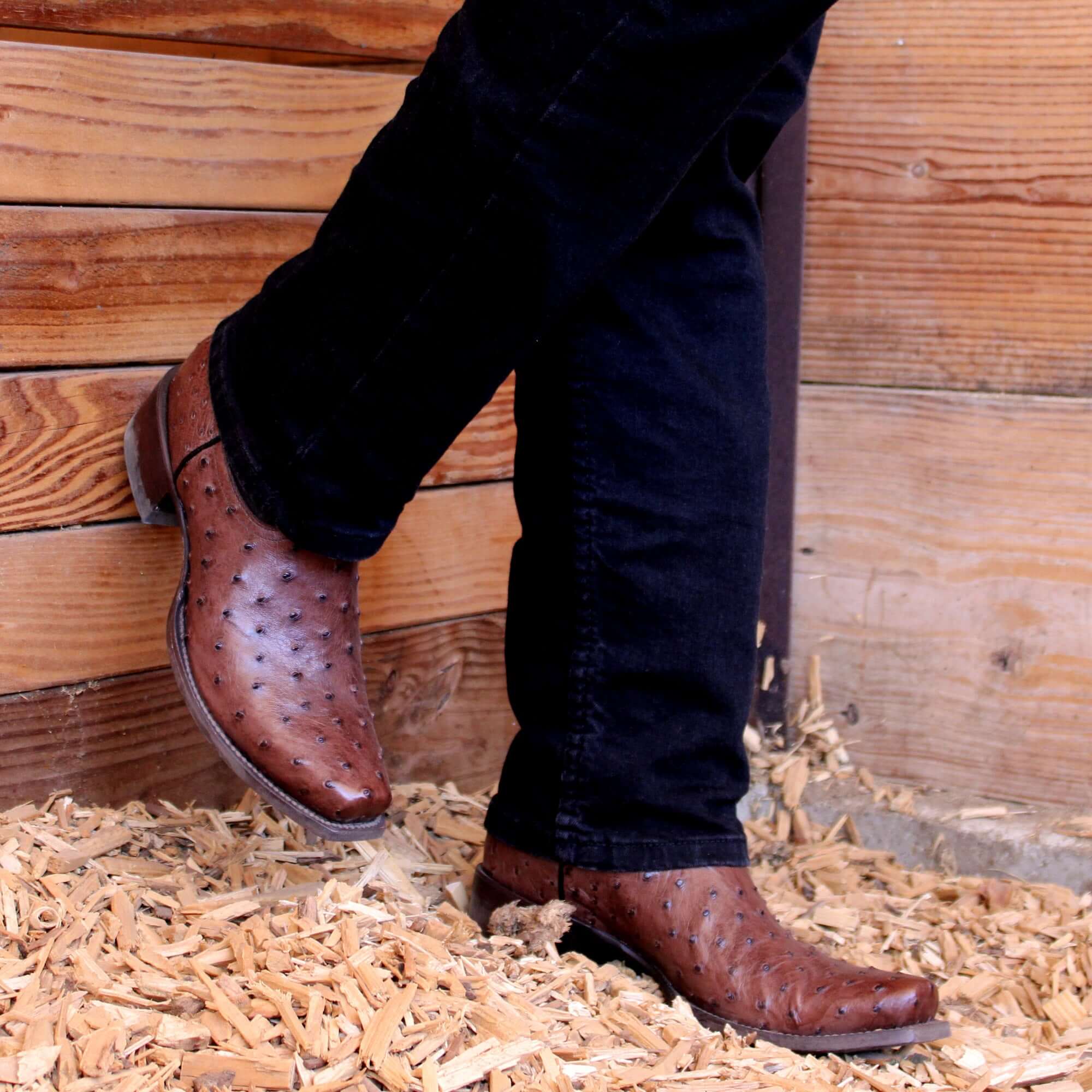 Mens mocha leather western boots with narrow square toe and decorative stitching, featuring full-quill ostrich leather on the foot for added texture.