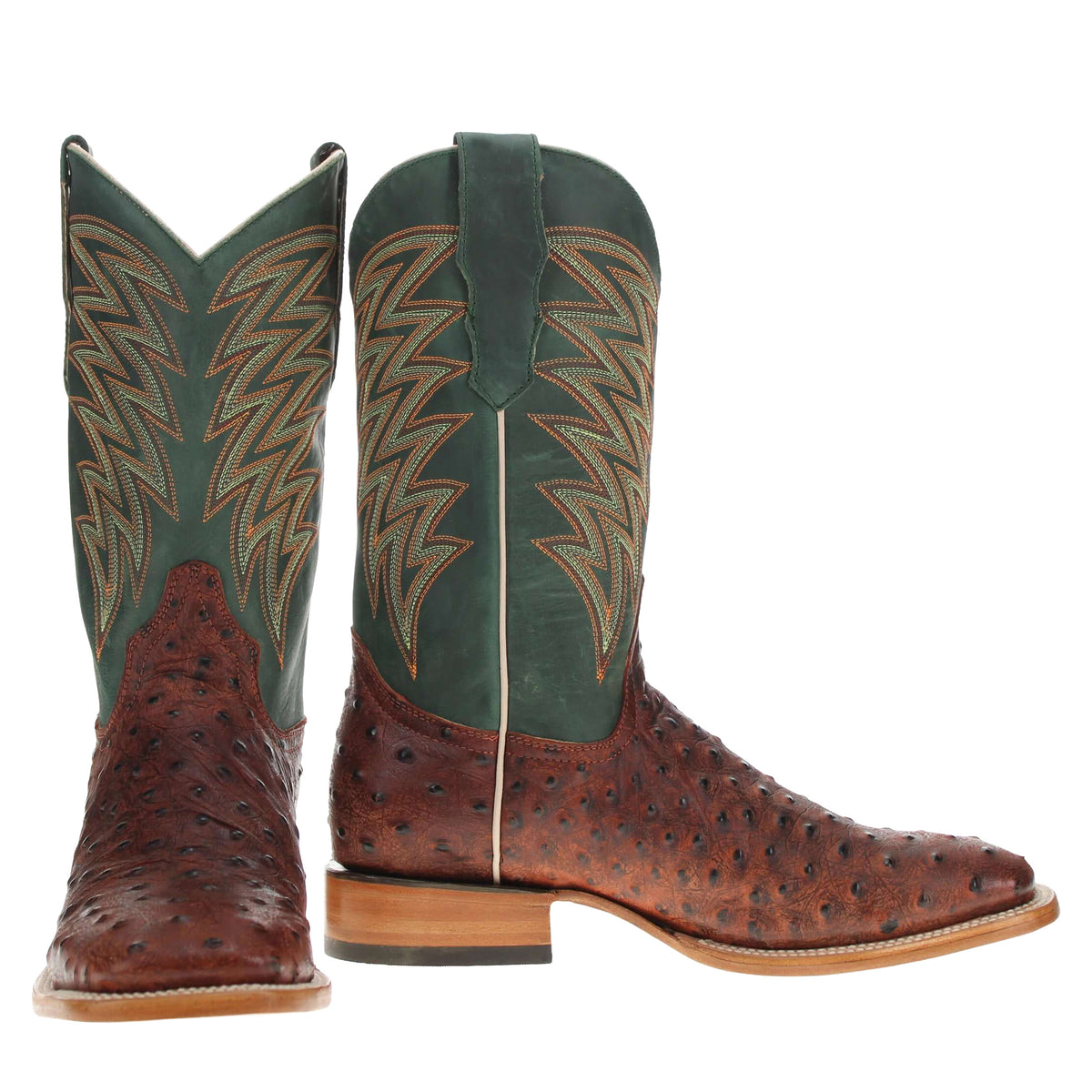 Two Western cowboy boots side view: tall green shaft with tan leaf stitch and brown foot.