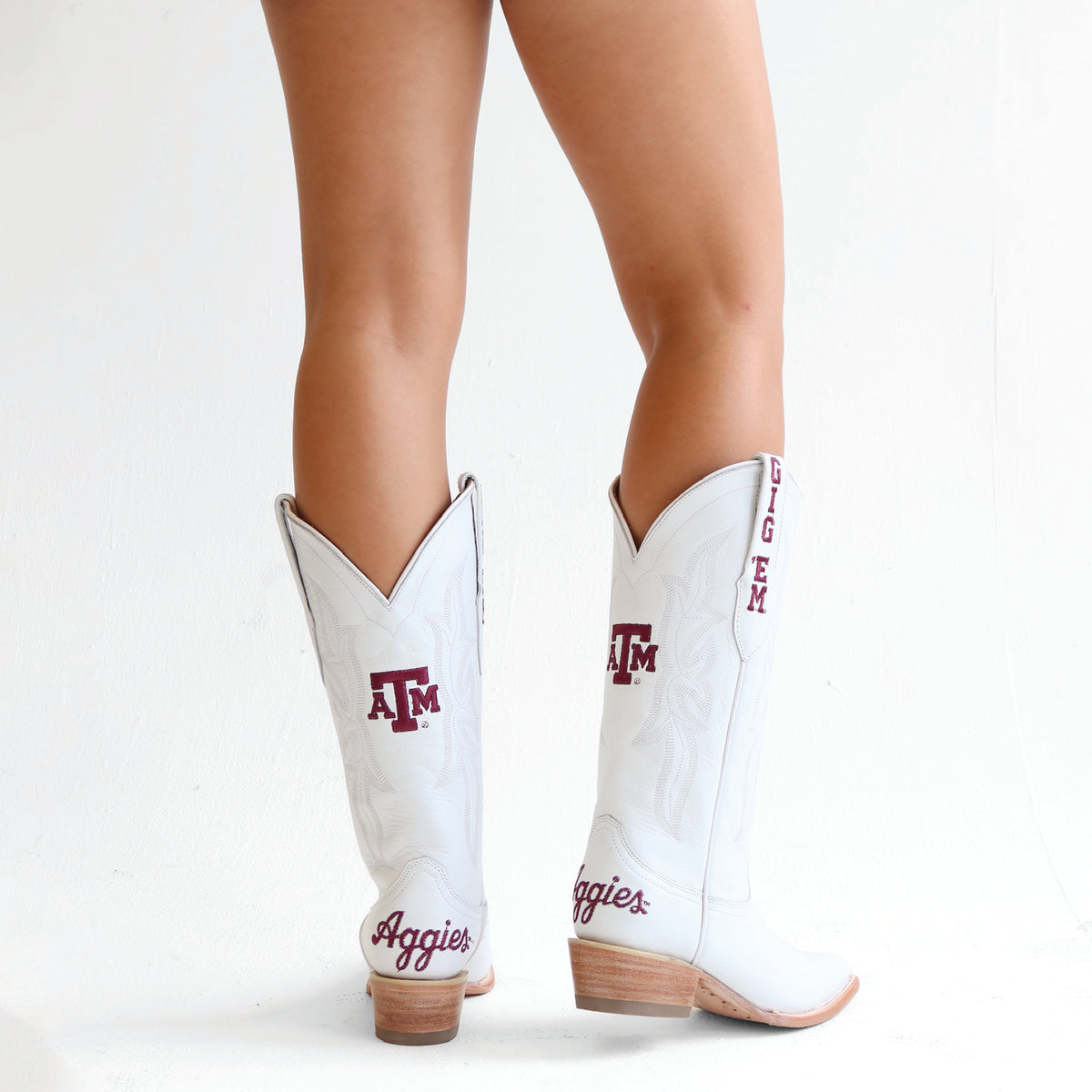 Lainey white cowboy boots with maroon and gold logo embroidery, stacked heel