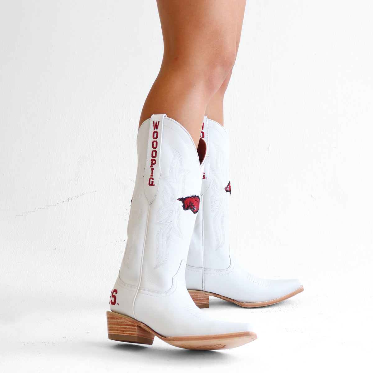 White cowboy boots with red text and hog graphic patch, mid-calf shaft