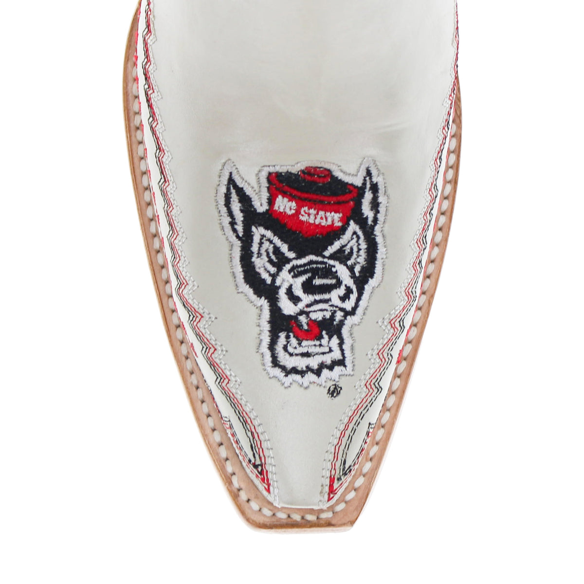 Close-up of white boot shaft with dog face logo patch and red/gray stitch trim