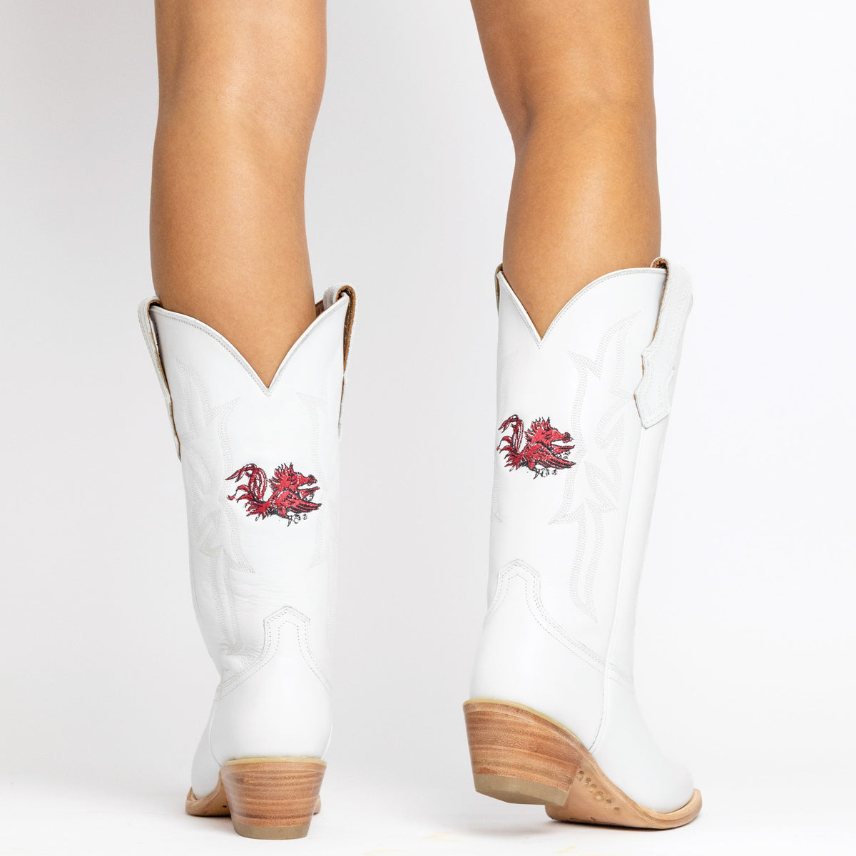White cowboy boots with red horse embroidery and cowboy stitching, tan stacked heel